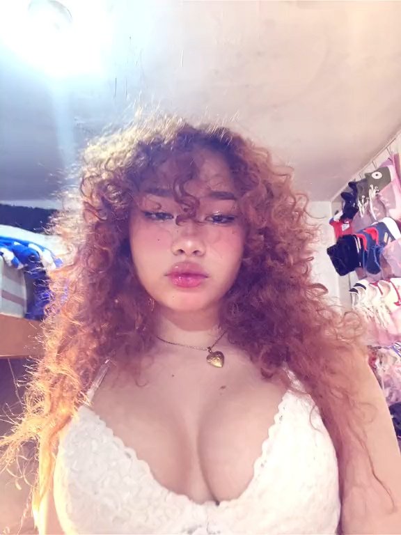 Naughty Asian Redhead Showing Off That Tight Curly Hair and Body 52