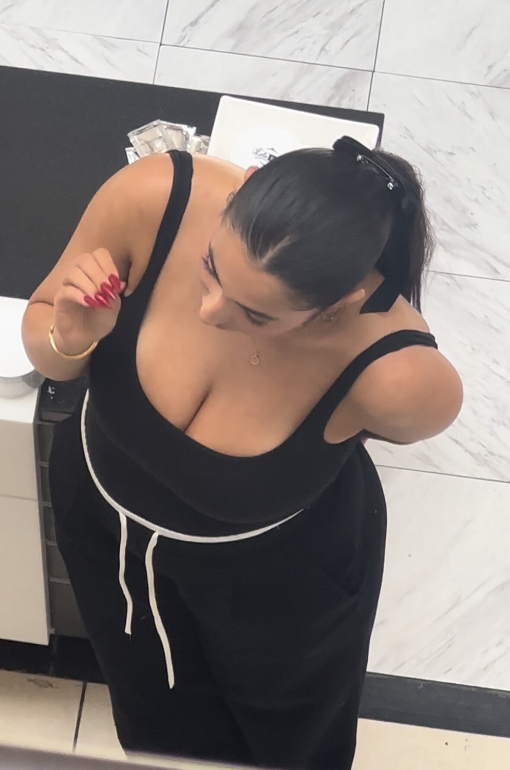 Busty Latina Mall Worker Flashes Her Massive Cleavage In Public 3