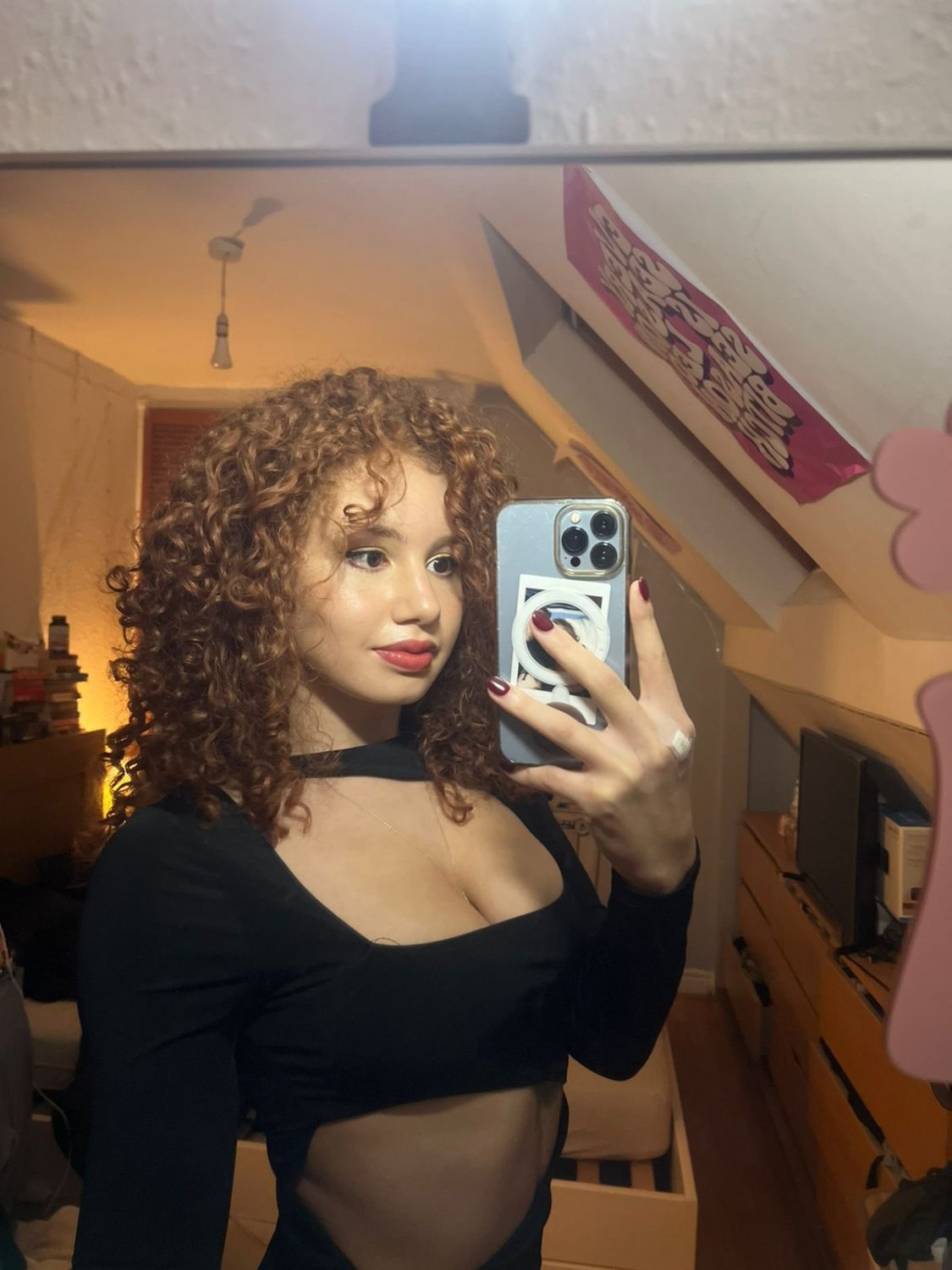 Redhead in Lingerie Snaps a Sultry Shot 28