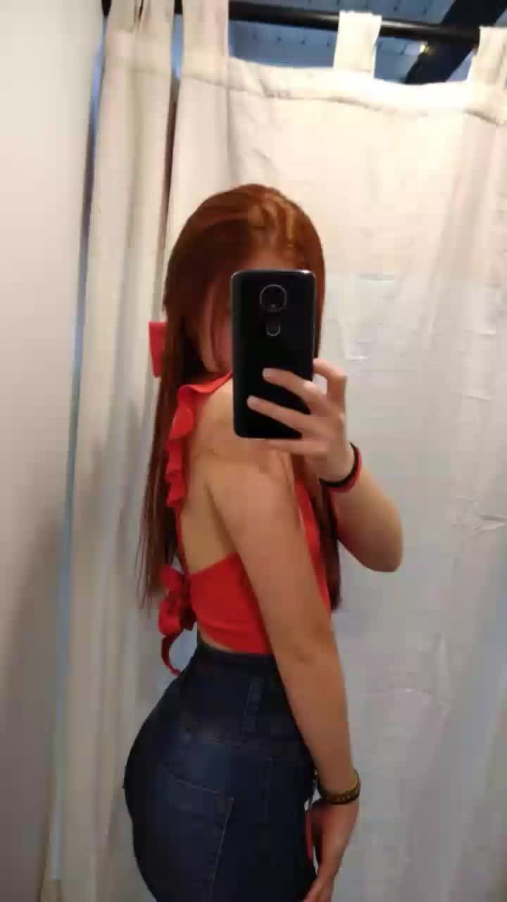 Redhead Seductress Strips And Smiles For You 1